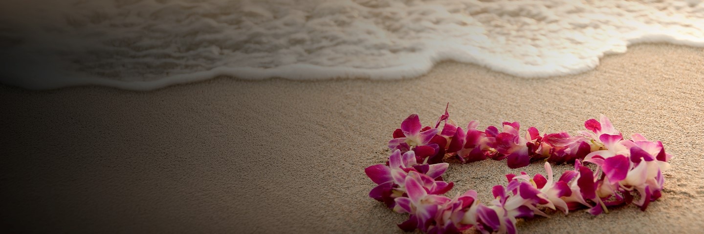 A Hawaiian lei laying on the sands of the beautiful Hawaiian islands