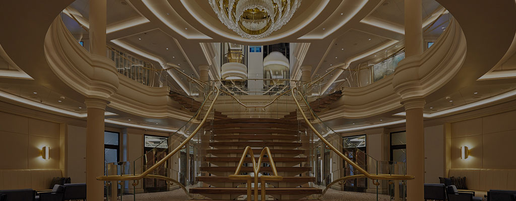 the chandelier and staircase in the atrium on board Seven Seas Splendor