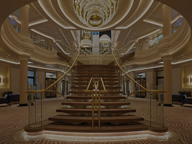 the chandelier and staircase in the atrium on board Seven Seas Splendor