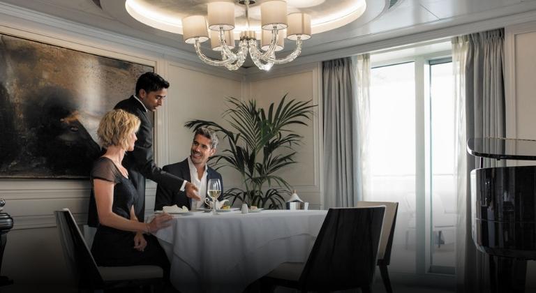 exclusive cruise trip couple sitting together by a window