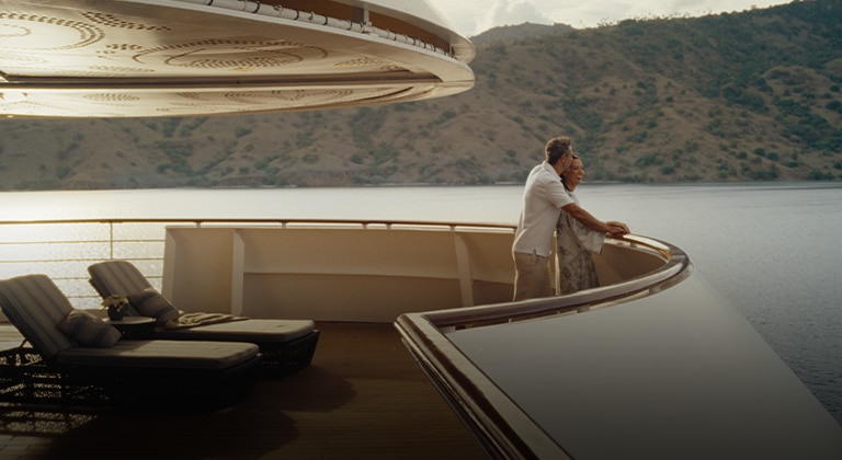 couple standing together overlooking the ocean
