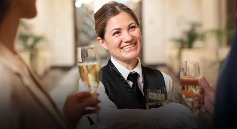 crew member displaying our Heartfelt Hospitality