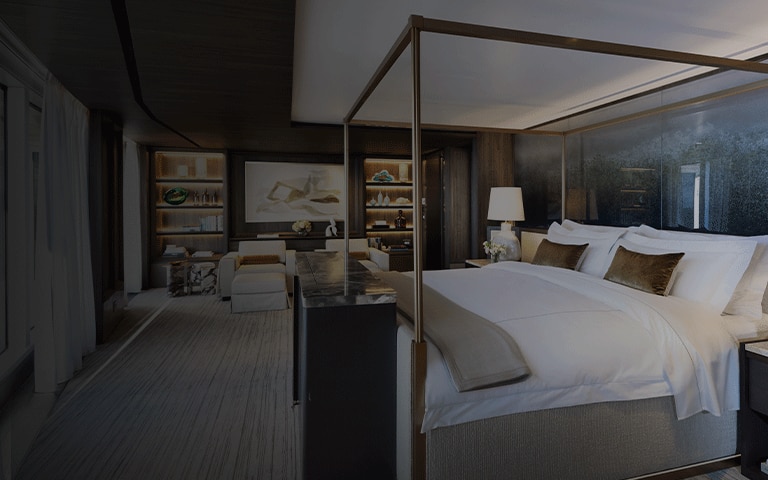 Bed on a suite within one of the Regent cruise ships