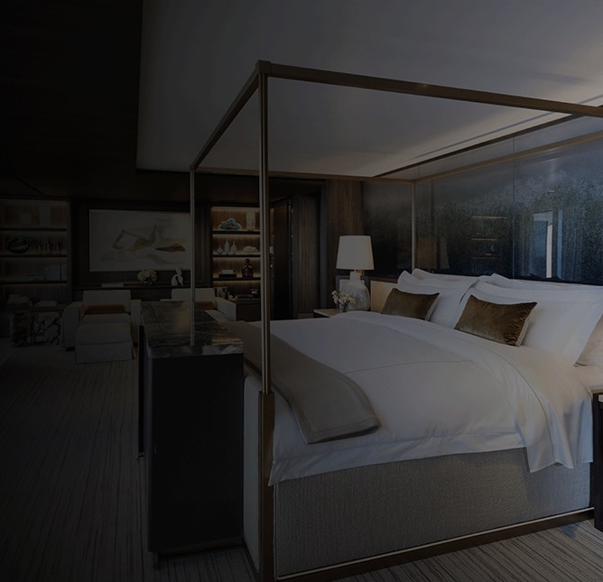 Bed on a suite within one of the Regent cruise ships