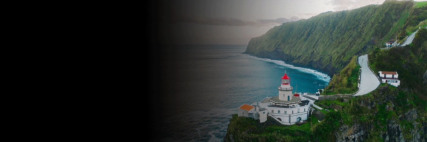 Lighthouse on cliffside in São Miguel, Azores overlooking the Atlantic Ocean