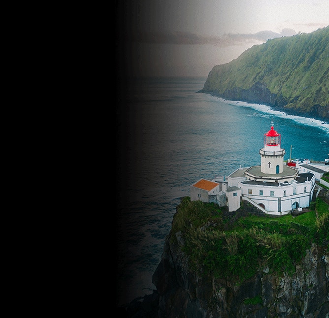 Lighthouse on cliffside in São Miguel, Azores overlooking the Atlantic Ocean