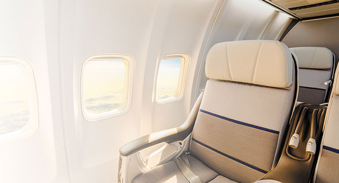 free airfare in business class airplane seat with window view