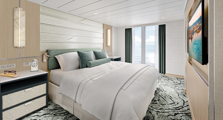 bed room aboard regent seven seas cruises on explorer class reimagined suite