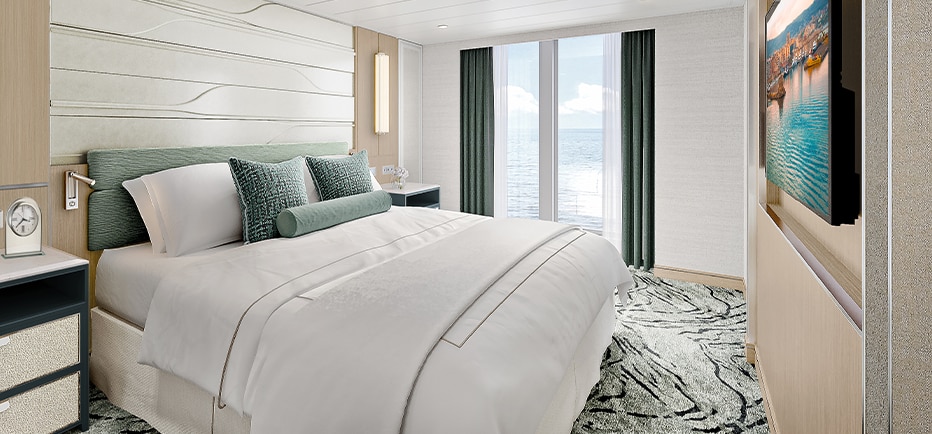 bed room aboard regent seven seas cruises on explorer class reimagined suite