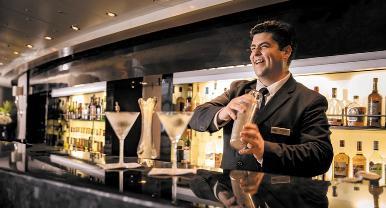 Regent bartender serving premium spirits
