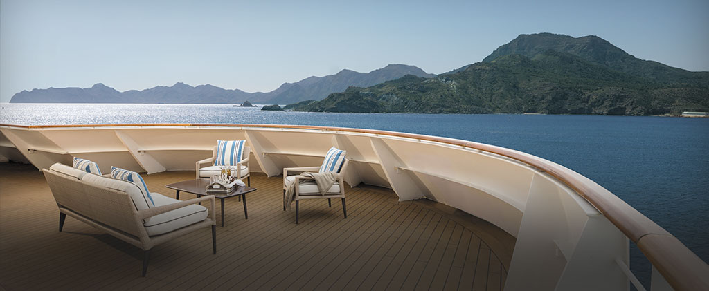 large balcony aboard a cruise ship overlooking the ocean