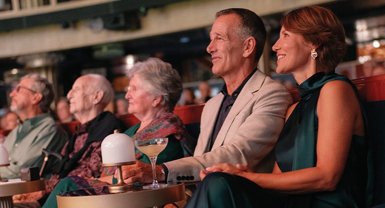 guests watching show on a regent seven seas cruise