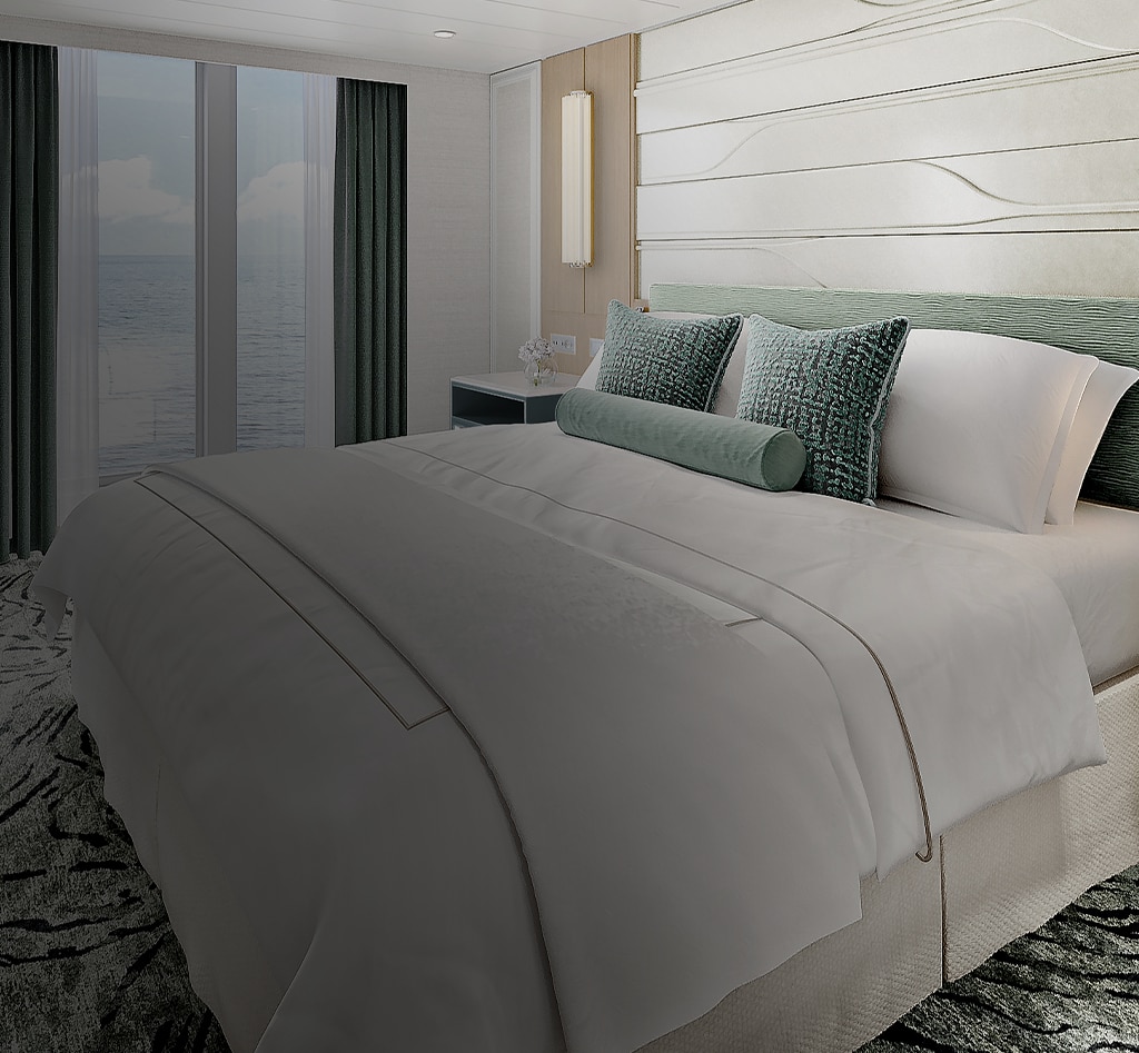 bed room aboard regent seven seas cruises on explorer class reimagined suite