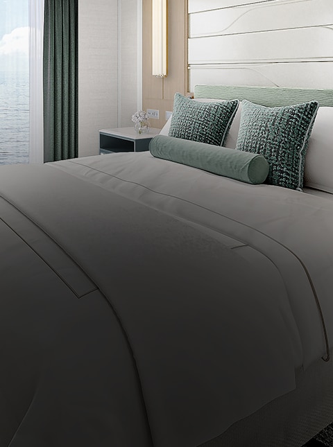 bed room aboard regent seven seas cruises on explorer class reimagined suite
