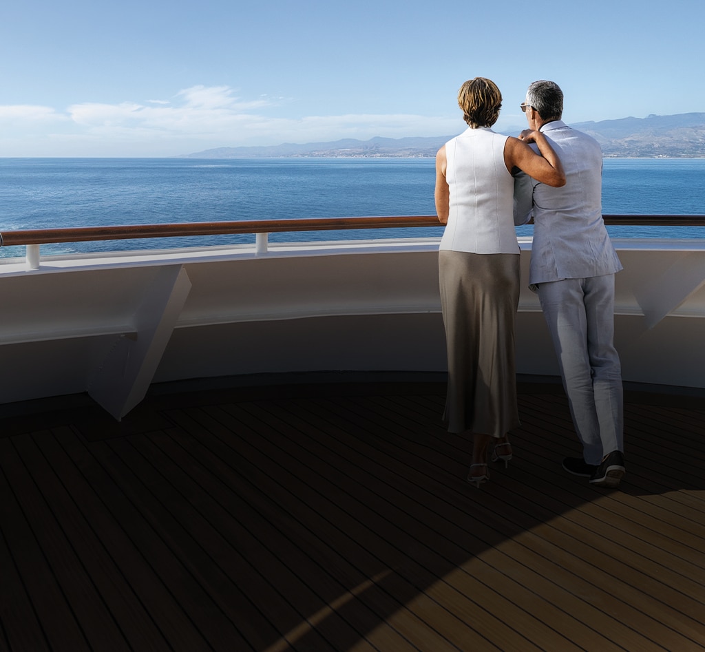 Couple enjoying the views from a Regent luxury cruise ship