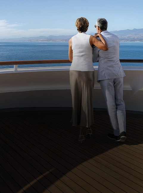 Couple enjoying the views from a Regent luxury cruise ship