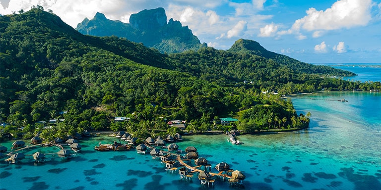 Overwater bungalows and lush mountains in Bora Bora, French Polynesia