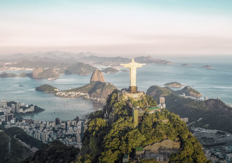 Premium Photo  Yacht club in urca bay of rio de janeiro and christ the  redeemer between the clouds leaning out